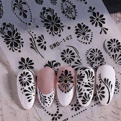 NEWSPIED lifestyle shot of finished blue floral manicure boosting style