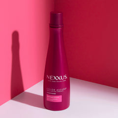 Nexxus conditioner applied to wet hair demonstrating smooth detangling