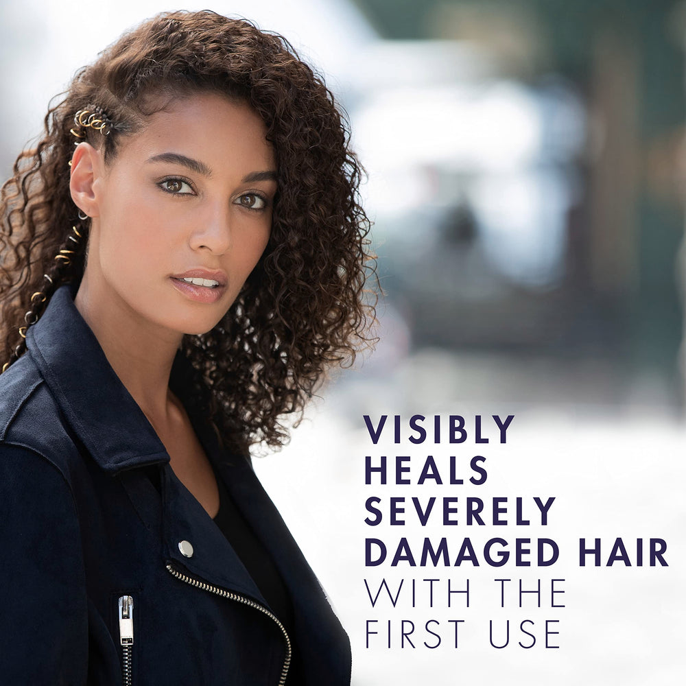 Nexxus Keraphix applied in shower demonstrating how the system repairs and smooths wet hair
