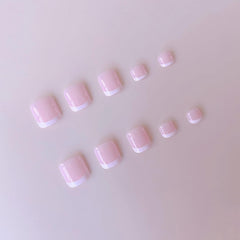 NHIXK applying a press-on nail on a finger, demonstrating simple 15-second at-home application