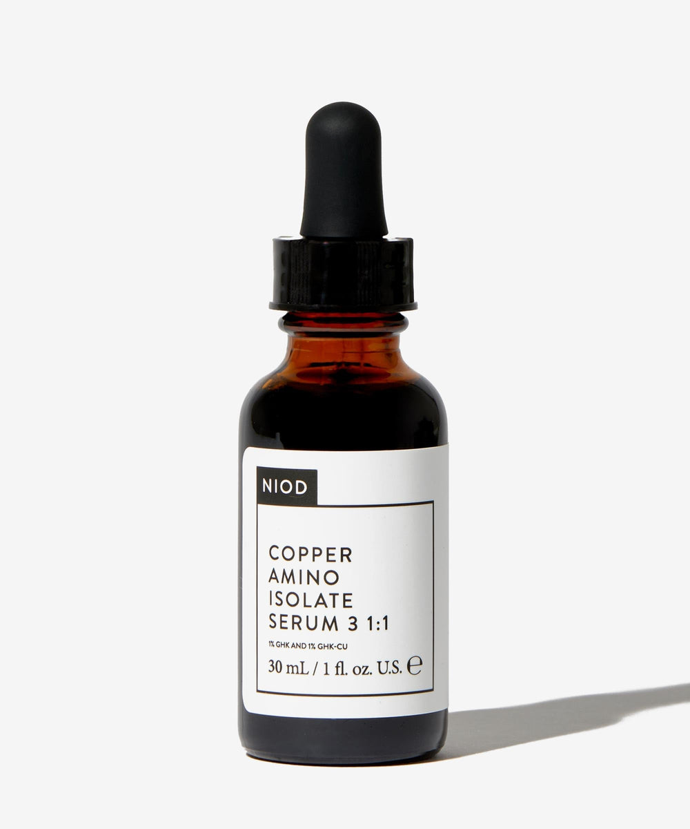 NIOD serum dropper releasing liquid, demonstrating lightweight texture and quick absorption
