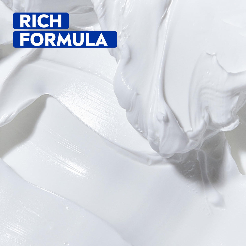 Small amount of NIVEA Creme on cheekbone demonstrating gentle face use