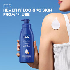 NIVEA lotion being dispensed into hand demonstrating easy application