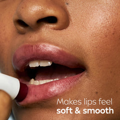 NIVEA watermelon stick with open cap showing compact travel-friendly design and tint