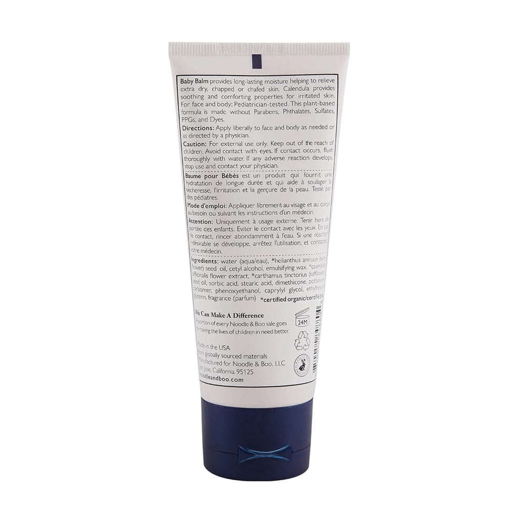 Noodle & Boo balm texture close-up on fingertip, demonstrates rich non-greasy hydration