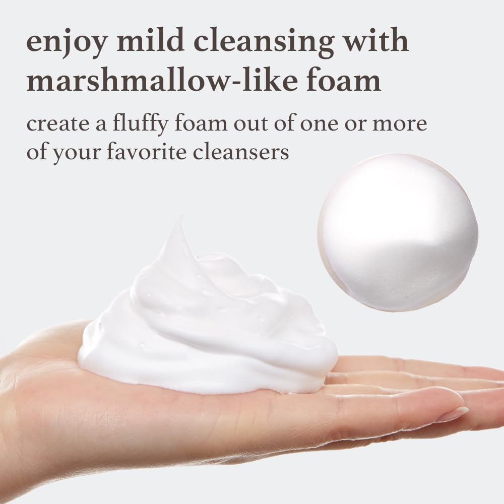 NOONI foam in use on hand showing plush lather for gentler cleansing