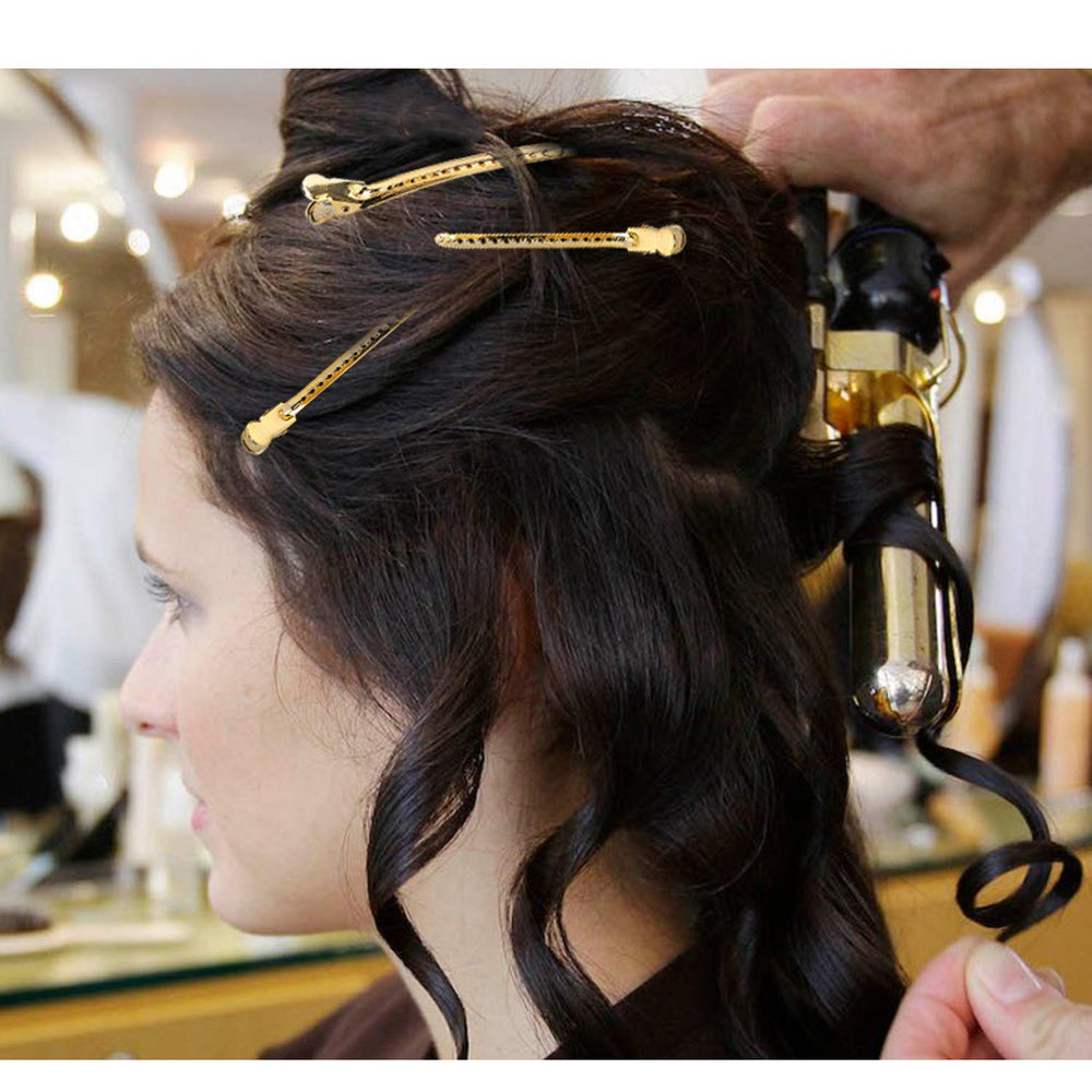 NORACLAN clips beside a hand showing scale and ease of handling for stylists