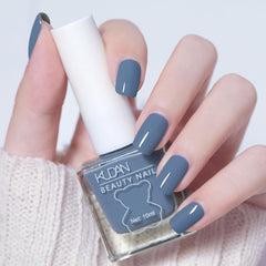 NovaCharm bottle front packaging showing deep blue polish and brand benefit