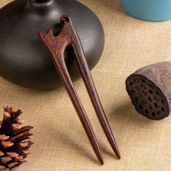 Noverlife hair sticks holding a chignon bun to demonstrate secure everyday updo
