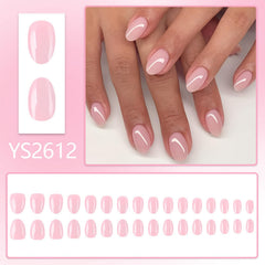 Nxtpz nails held in hand to show short almond length and realistic scale for comfort