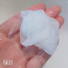 NYKKOLA expanded mask on hand demonstrating full-size coverage and softness