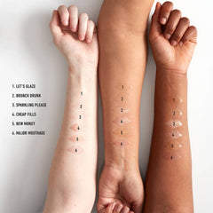 NYX PROFESSIONAL MAKEUP swatches on arm reveal sheer copper-gold sparkle and buildable color