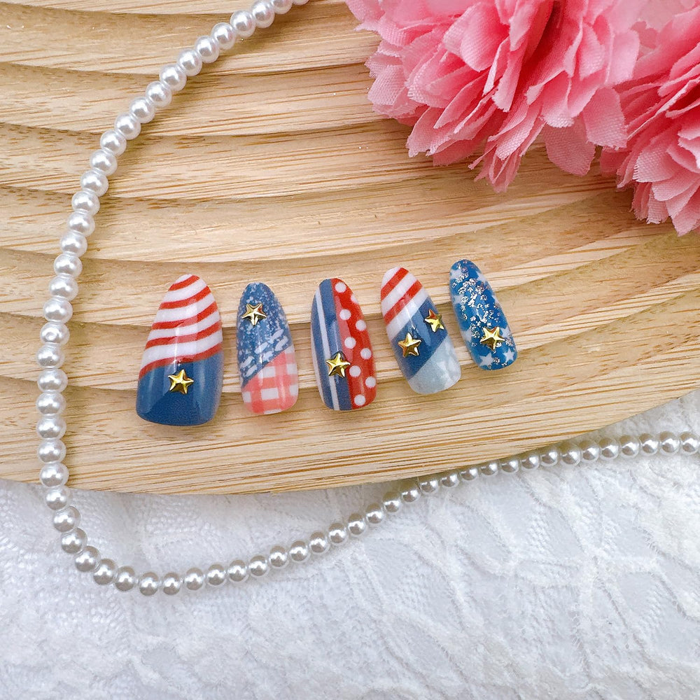 NZRAESTRS nails on hands at a Fourth of July party for instant celebration look