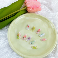 NZRAESTRS nails worn on hand lifestyle image demonstrating wearable almond shape and charm