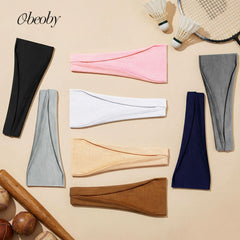 obeoby runner wearing headband outdoors for sweat absorption benefit