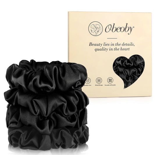 obeoby front view of black silk scrunchie shows smooth finish and elegant sheen