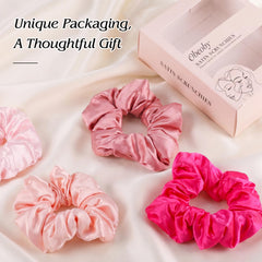 obeoby scrunchie beside hand to show size and secure fit benefit