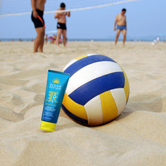 Ocean Potion bottle on a beach towel, water-resistant active use