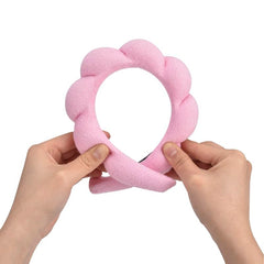 OCTAZI headband in use while washing face, keeping hair neatly back