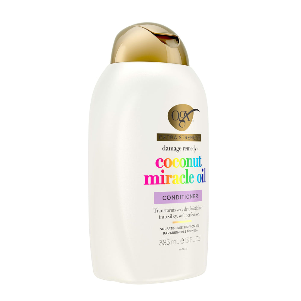 OGX conditioner dispensed on hand for easy application and slip
