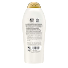 Model with smooth, soft hair after using OGX conditioner showing improved manageability