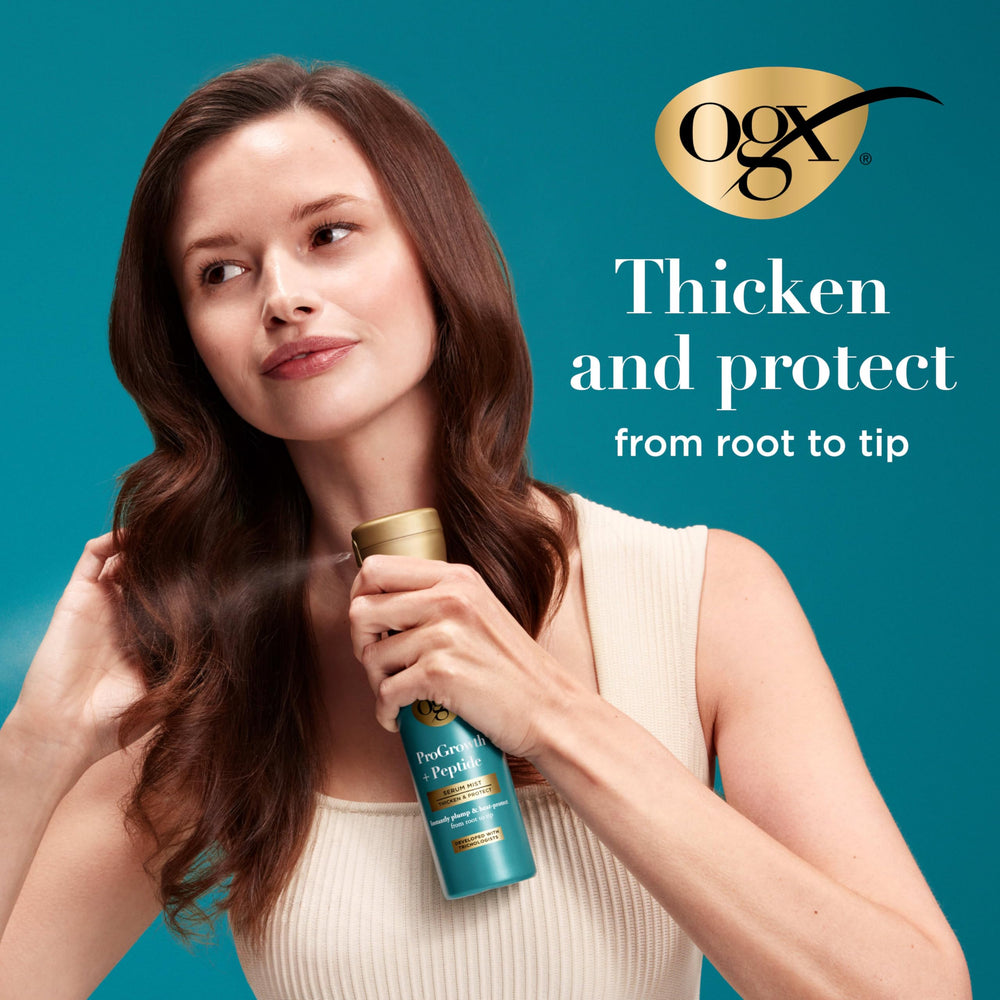 Hand holding OGX bottle to show size and travel-friendly 6.5 fl oz convenience