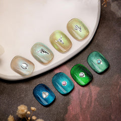Ohmique charm beside coin for scale to show compact size benefit