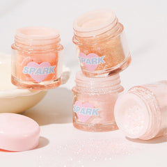 Okerker glitter next to coin showing particle size and blendability