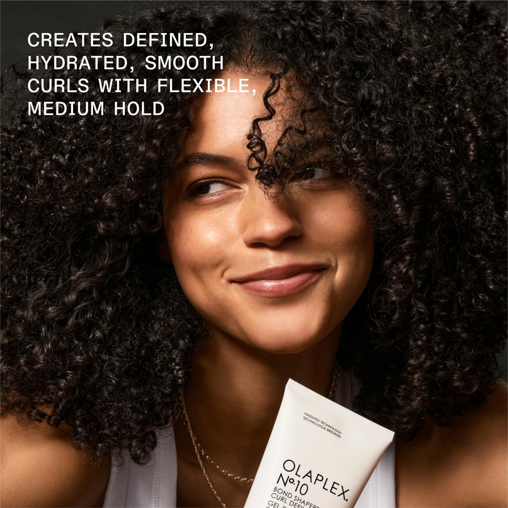 Olaplex Nº.10 dispensed in hand illustrating optimal amount and effortless spread for curls