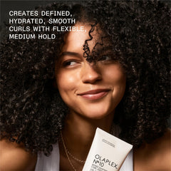 Olaplex Nº.10 dispensed in hand illustrating optimal amount and effortless spread for curls
