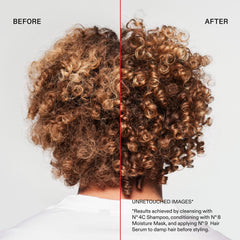 Person rinsing hair in shower with Olaplex, illustrating clarifying use and refreshed scalp