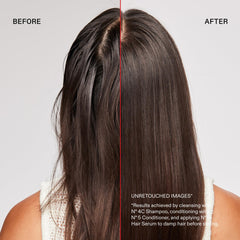 Olaplex 8.5 fl oz next to a phone for scale, showing compact travel-ready packaging benefit