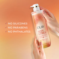 Olay bottle beside hand to illustrate 20 fl oz size and scale