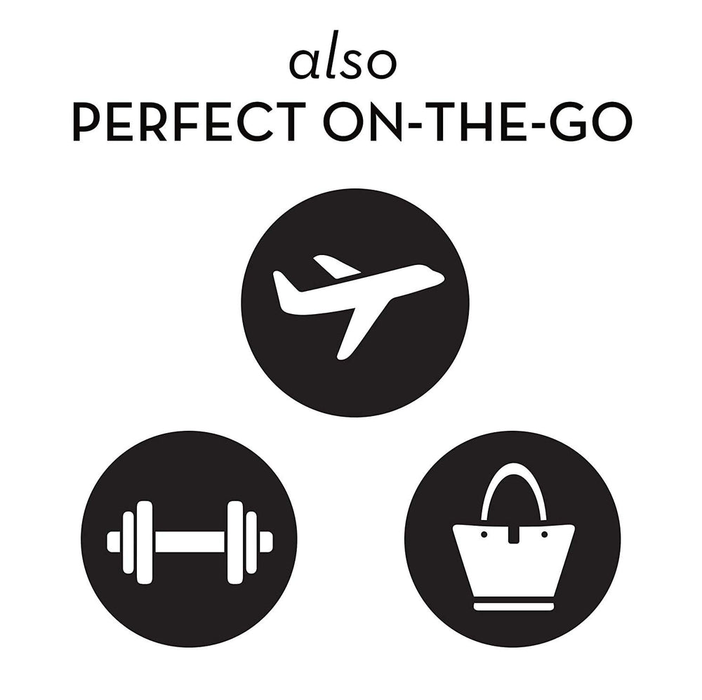 Olay wipes next to travel essentials showing convenient on-the-go cleansing