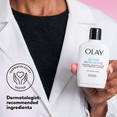 Olay 6 fl oz bottle beside a coin showing scale and travel-friendly benefit