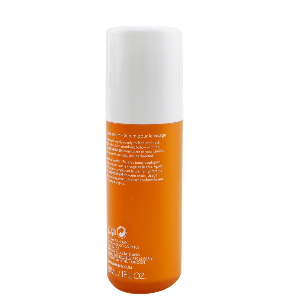 Ole Henriksen applying serum to face in morning routine delivering brightening benefit