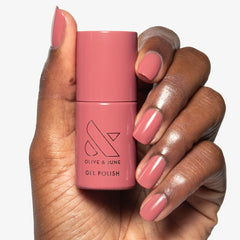 Olive & June gel polish application on fingernails delivering salon-quality color