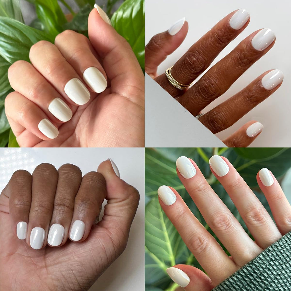 Olive & June nails worn on hand lifestyle image showing extra short round look and everyday style
