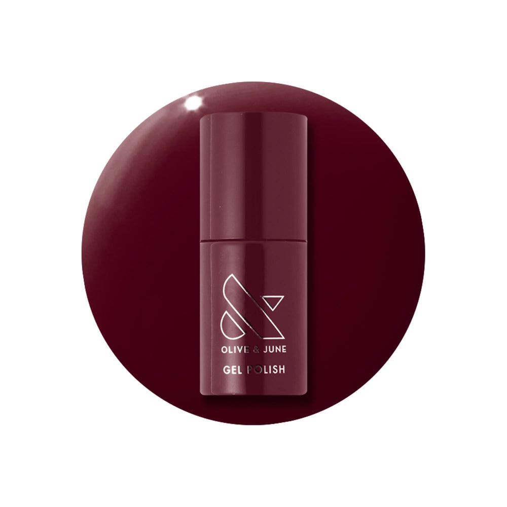 Olive & June bottle front view showing Obsessed Dark Ruby and glossy finish