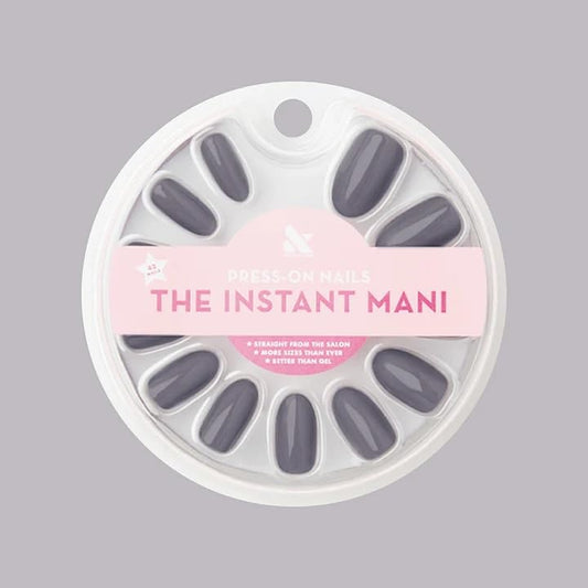 Olive & June front packaging showing full Instant Mani kit and tools, clear convenience benefit