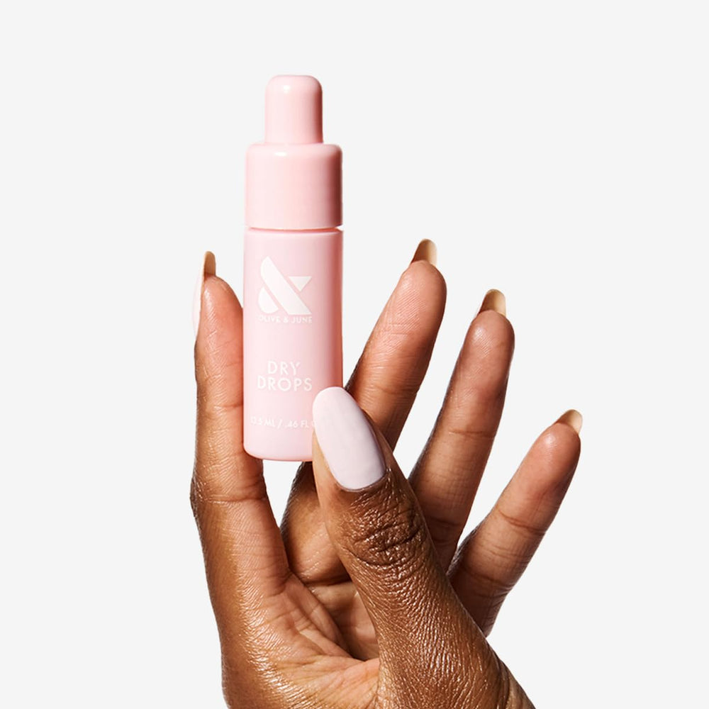 Olive & June squeeze applicator close-up demonstrating controlled single-handed application benefit