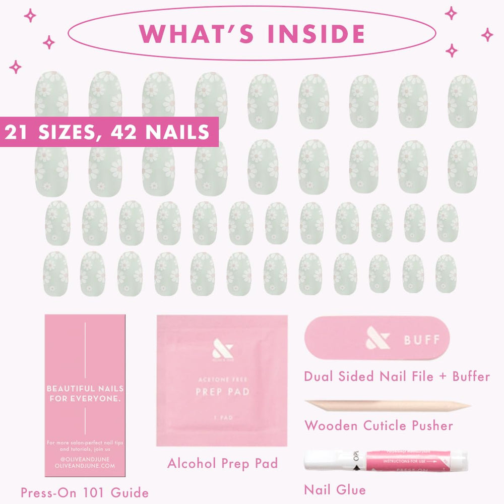Olive & June nails placed beside a ruler showing short round scale and fit
