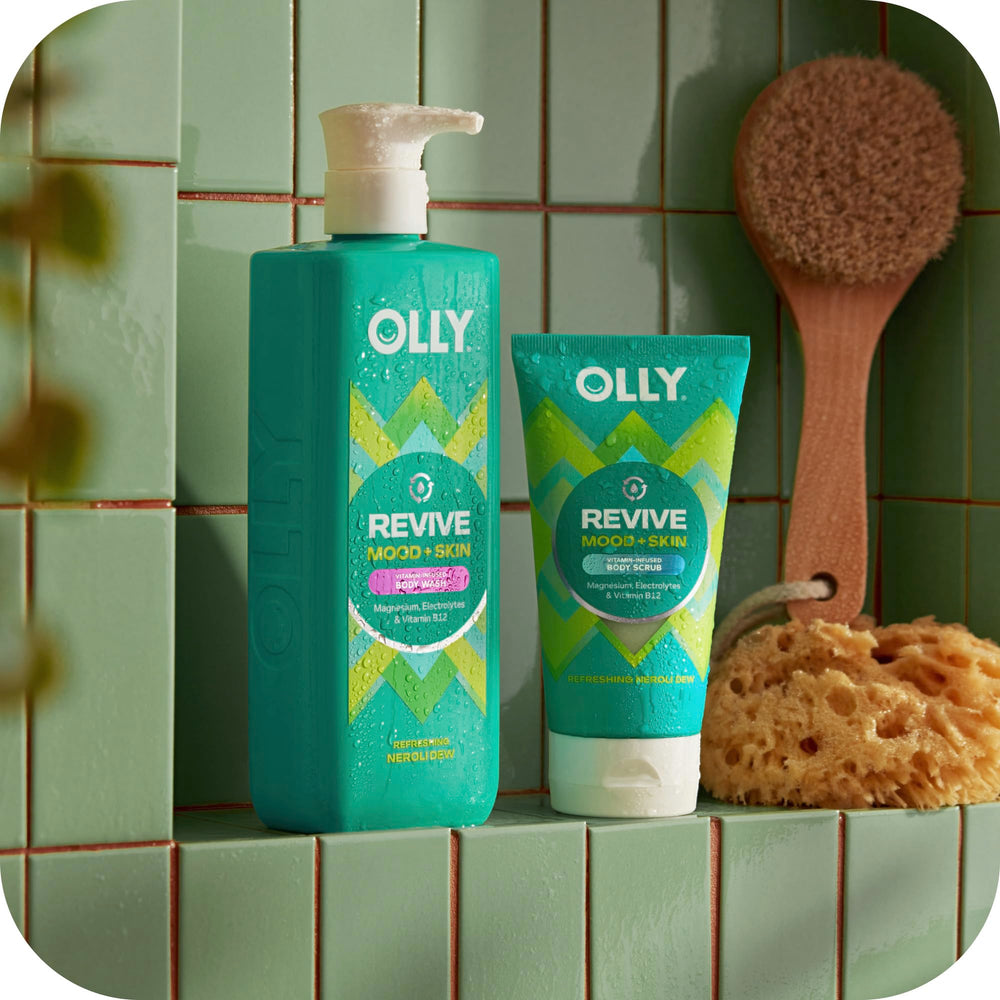 OLLY body wash in shower being lathered demonstrating mood-lifting scent
