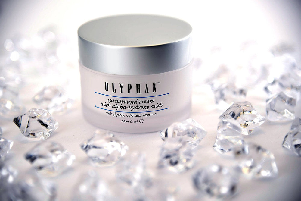 OLYPHAN applied to model's cheek demonstrating gentle exfoliation and hydrated glow