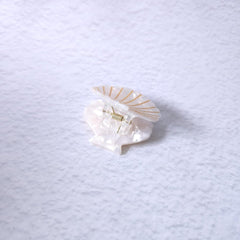 OMG Decor white shell claw clip worn in hair demonstrating tidy hold and style