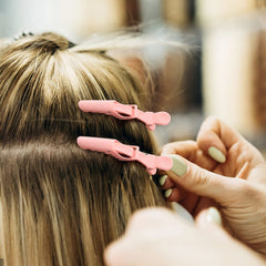 Ondder clips in salon use holding hair sections to speed styling process