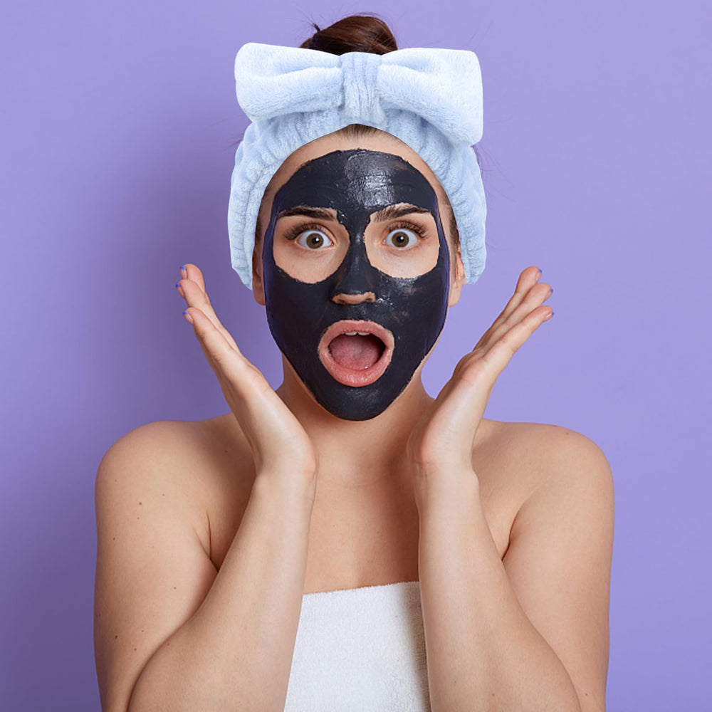 Ondder model washing face with headband keeping hair neatly back