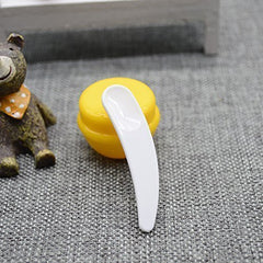 Onwon spoons beside a coin showing compact 5.6 cm scale for travel