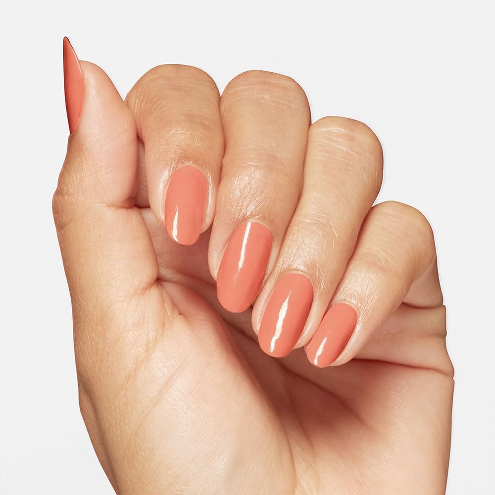 OPI painted nails in Apricot AF worn on hands showing durable high-shine