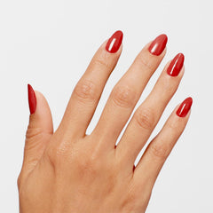 Close-up of Big Apple Red gloss on nail showing high-shine salon look
